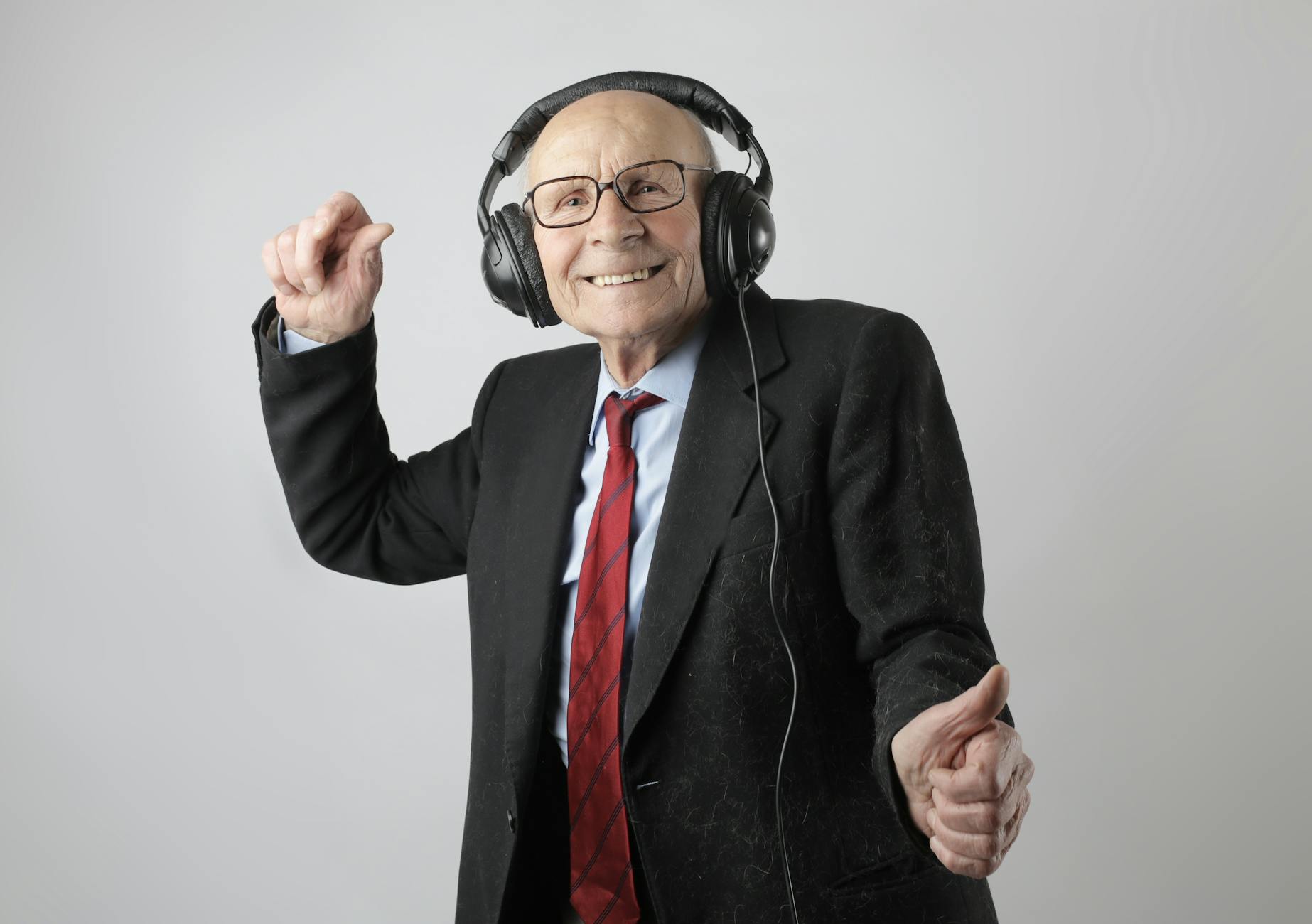 Introducing The Regeneration Generation 3 cheerful elderly man listening to music in headphones