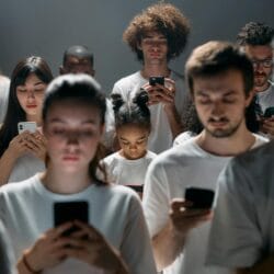 photo of people engaged on their phones