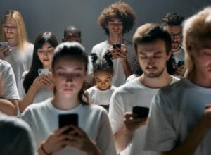 photo of people engaged on their phones