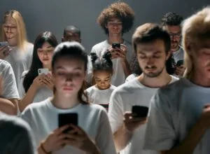 photo of people engaged on their phones